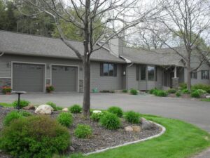 A grey home with new siding