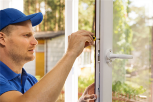 A technician installing slider windows