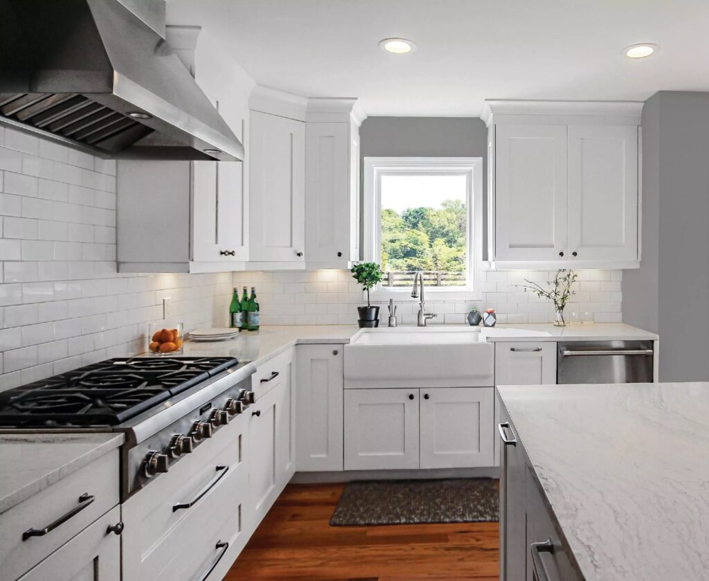 Bright white kitchen with modern cabinets and hardwood floors