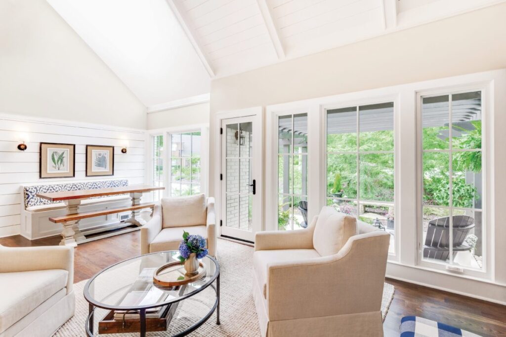Bright living room with large windows and seating